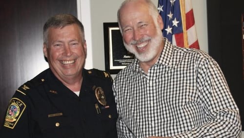 Lawrenceville Police Chief Randy Johnson (left, pictured with brother and former Norcross Mayor Bucky Johnson) will retire from the department in March.