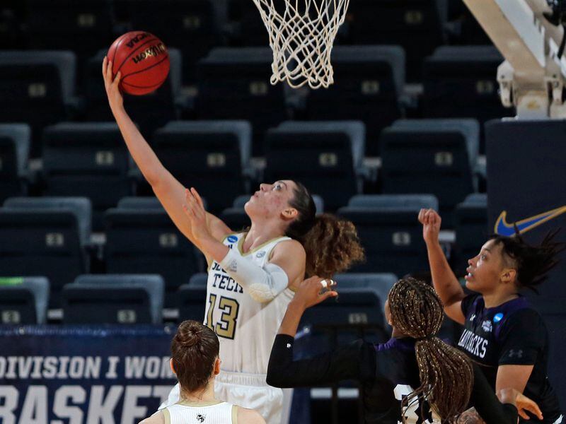 Georgia Tech forward Lorela Cubaj (13) scores on a reverse layup past Stephen F. Austin forward Avery Brittingham (11) during the second half of their first-round women's NCAA Tournament game Sunday, March 21, 2021, at the Greehey Arena in San Antonio, Texas. (Ronald Cortes/AP)