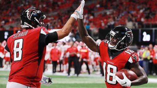 Falcons rookie wide reciever Calvin Ridley gets five from backup quarterback Matt Schaub after hooking up for a touchdown reception for a 14-3 lead over the Chiefs on Friday, August 17, 2018, in Atlanta. Curtis Compton/ccompton@ajc.com