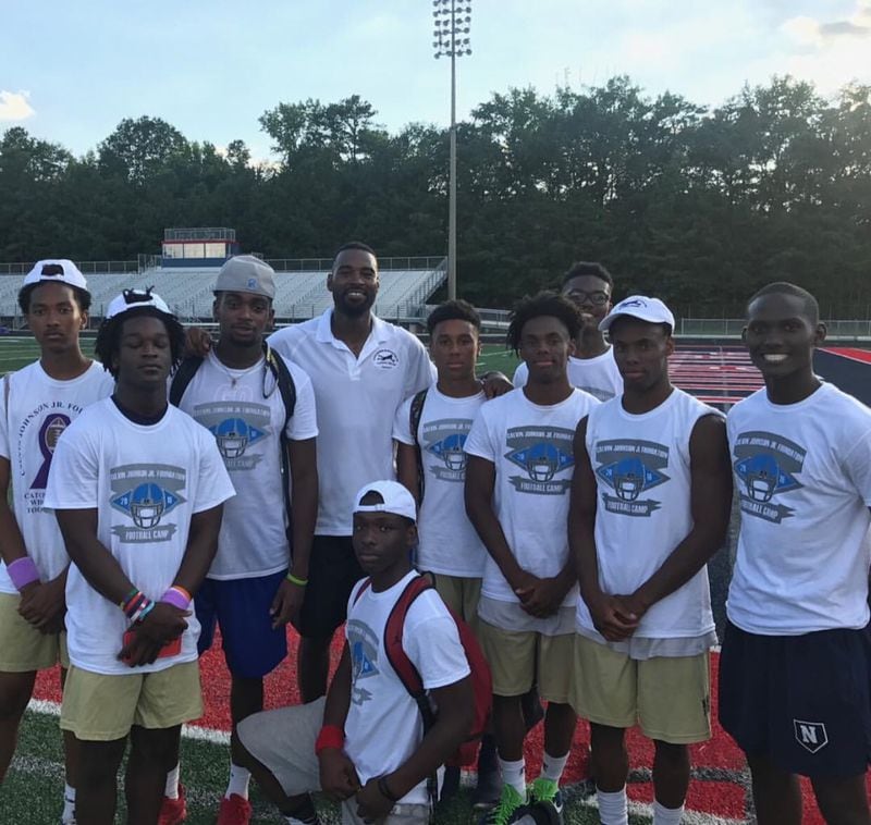 Georgia Tech freshman wide receiver Pejé Harris attended Calvin Johnson's wide receiver camp four times and paid close attention to the Tech great's lessons. Harris is to Johnson’s immediate right. (Courtesy Pejé Harris)
