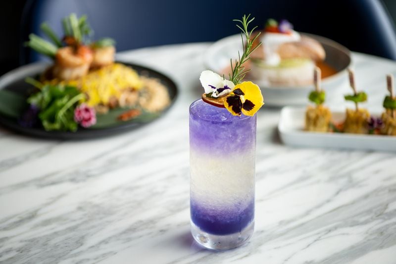 Yao's Mr. Yao cocktail with Empress 1908 Gin, chardonnay, Cointreau liqueur, and butterfly pea flower syrup. (Mia Yakel for The Atlanta Journal-Constitution)