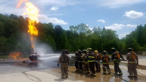 Firefighters conduct live fire training at the Cherokee County Fire & Emergency Services training facility in Holly Springs. CHEROKEE COUNTY FIRE TRAINING COMPLEX via Facebook