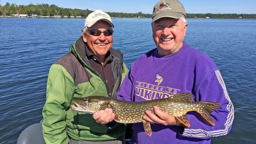 Longtime Brainerd-Nisswa area fishing guide Marv Koep, left, with Fr. Mike Arms, a regular walleye-angliing partner and retired Catholic priest who moved from the Twin Cities to Crosslake and now lives in a lake cabin that has been in his family for 80 years. (Dennis Anderson/Minneapolis Star Tribune/TNS)