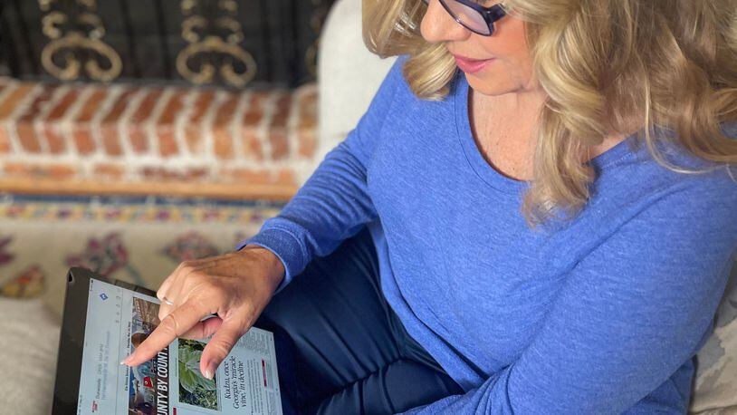 June Sullenger, a subscriber to The Atlanta Journal-Constitution, views our ePaper digital edition recently.