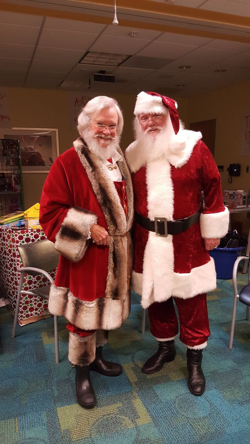 Judge T. Jackson Bedford and Bill Odom embrace the role of Santa every year. CONTRIBUTED