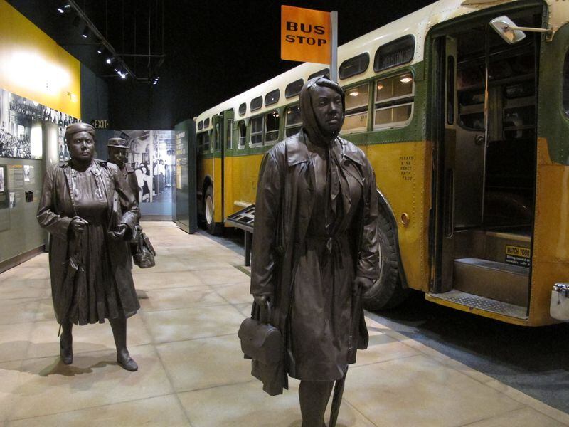 FILE - This March 19, 2014 photo shows statues of three women walking next to a replica of a city bus, part of an exhibit about Montgomery’s bus boycotts at the newly-renovated National Civil Rights Museum in Memphis, Tenn. The museum, which first opened in 1991, is now ready to show off new, emotionally-moving exhibits and flashy, informative interactive displays. The museum says it attracts 200,000 people every year, but the renovations are impressive enough that they could lead to a spike in visitor turnout. (AP Photo/Adrian Sainz)