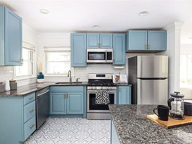 Blue cabinetry is among the features of the recently updated kitchen.