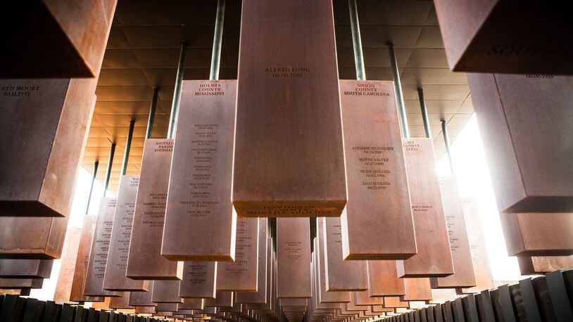 Hanging steel monuments dangle like bodies above visitors at the National Memorial for Peace and Justice in Montgomery, Ala. The names of lynching victims are inscribed on the monuments. CONTRIBUTED BY EQUAL JUSTICE INITIATIVE