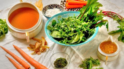 Good food doesn’t have to be complicated, as seen with recipes for Scrappy Stock (left), Homemade Yogurt (second from left), Pickled Carrots (top, center), Spring Greens Salad (center) with Shallot Vinaigrette (right), and Carrot-Top Pesto (bottom, center). (Styling by Julia Skinner / Chris Hunt for the AJC)