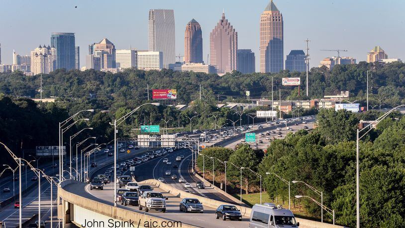 Traffic builds on the first Monday morning commute since the I-85 reopening. JOHN SPINK / JSPINK@AJC.COM