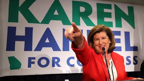 June 20, 2017, Atlanta: Karen Handel points at her supporters while thanking them during an early appearance after the first returns come in during her election night party in the 6th District race with Jon Ossoff on Tuesday, June 20, 2017, in Atlanta.    Curtis Compton/ccompton@ajc.com
