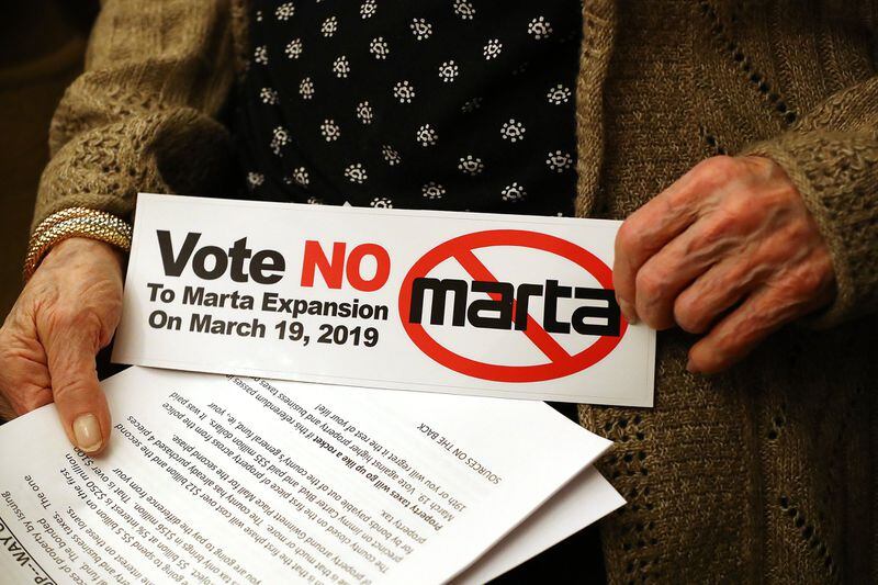 March 5, 2019 Lawrenceville: Mary Ann Blevins holds a bumper sticker she picked up with handout materials while attending a MARTA opposition meeting against Gwinnett’s MARTA referendum at the Gwinnett historic courthouse on Tuesday, March 5, 2019, in Lawrenceville. Curtis Compton/ccompton@ajc.com