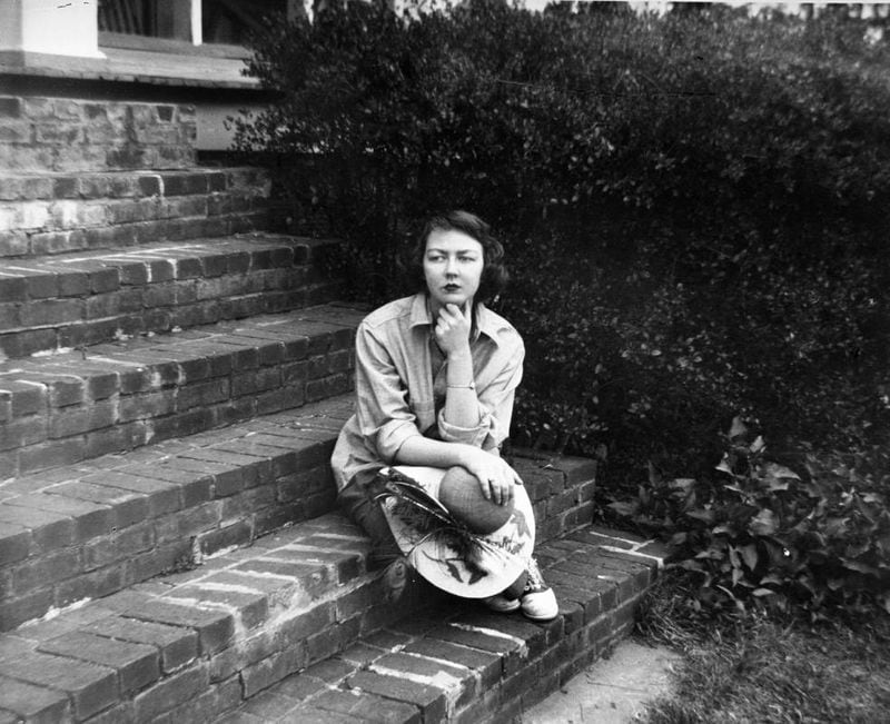 Flannery O'Connor sitting on the steps of her home in Milledgeville, Georgia, September 22, 1959. Floyd Jillson/AJC