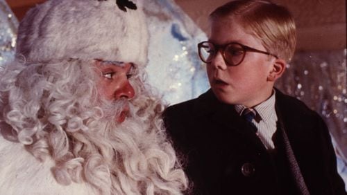 Ralphie (Peter Billingsley) visits a department store Santa (Jeff Gillen) as part of his campaign to find a BB gun under his tree in the classic holiday film “A Christmas Story.” Contributed by MGM