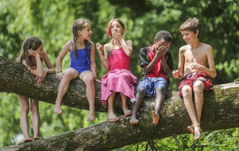 Every now and then, I feel like I'm channeling Norman Rockwell. May 18, 2015 Cobb County: Left to right - Audrey Bell-9, Kaitlyn Bell-7, Afrika Gorman-9, Konji Gorman-7 and Jaume Gorman-12 enjoy a laugh as they sat on a tree limb on the banks of the Chattahoochee enjoying a snack during their outing on Monday, May 18, 2015. The two home school families enjoyed a warm day for a river outing on the Chattahoochee at the Paces Mill Unit of the Chattahoochee River National Recreation Area in Cobb County located two miles south of Cumberland Mall and Cobb Galleria on US Highway 41. The area includes a picnic area, activity field, and access to the Palisades West hiking trails. Channel 2 Meteorologist Brad Nitz is calling for scattered showers and storms on Tuesday with a high of 86 and a low of 69. JOHN SPINK / JSPINK@AJC.COM