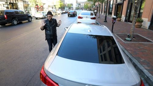 Midtown resident Christian Amaro recounts having his car broken into at Atlantic Station. The shopping plaza is now enforcing a stricter curfew for minors after recent shootings on the premises. (Miguel Martinez for The Atlanta Journal-Constitution)