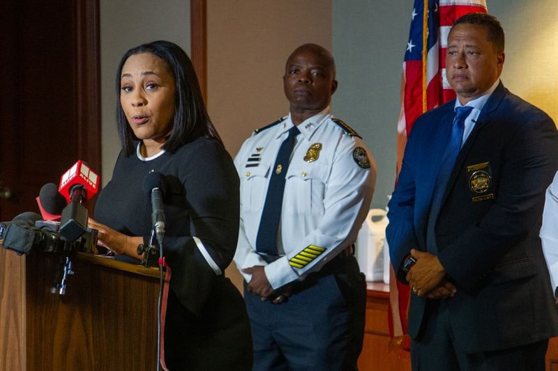 Fulton County District Attorney Fani Willis (L) talks at a press conference with Fulton County Sheriff Patrick Labat (R) and then-Atlanta Police Chief Rodney Bryant in Atlanta on May 10, 2022. (Steve Schaefer / steve.schaefer@ajc.com)