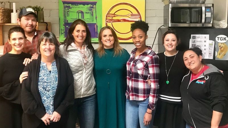 The staff at the Giving Kitchen. From left to right: Jen Hidinger, Bryan Schroeder, Mitzi Lewis, Naomi Green, Kristie Azaroff, Adriona Irom, Amanda Newsom and Leah Melnick. 