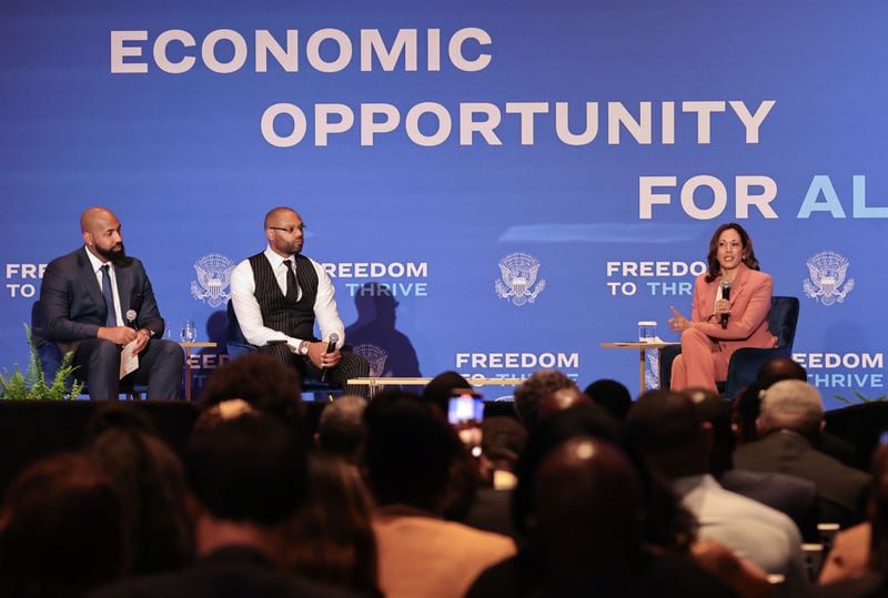 (Left to right) "Earn Your Leisure" podcast creators Troy Millings and Rashad Bilal joined Vice President Kamala Harris during an event Monday at the Georgia International Convention Center.