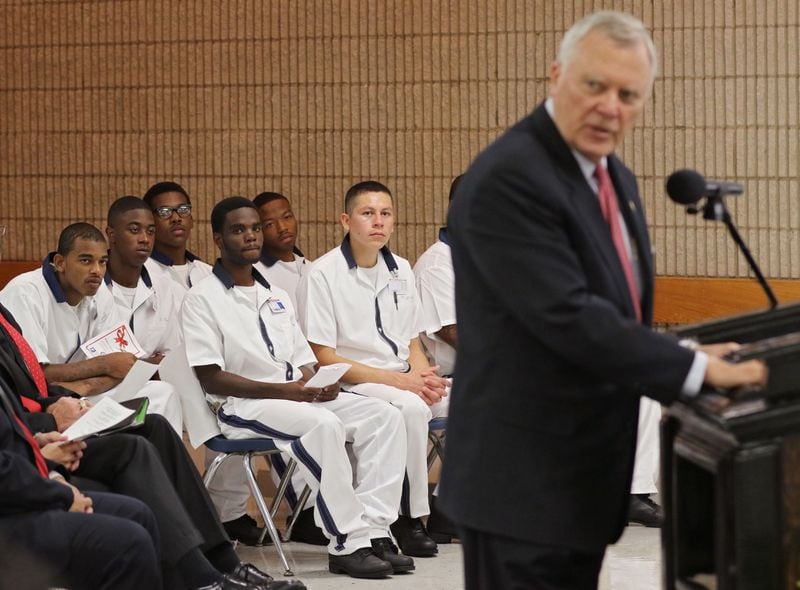 Inmate students listen to Gov. Nathan Deal's remarks during a ceremony to officially open the first of what he envisions as a statewide network of prison-based charter schools. The Foothills Education Charter School is at the Burruss Correctional Institute in middle Georgia BOB ANDRES / BANDRES@AJC.COM