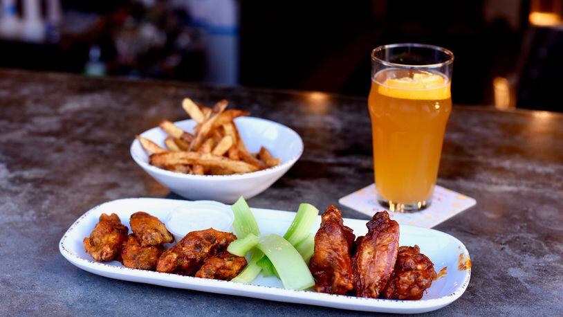 BoneYard Kitchen & Tap offers 20-some sauces for its wings, ranging from mild to ultra-hot.