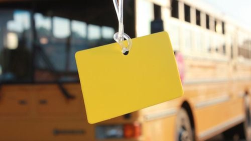 Children in Cobb schools may bring water containers on school buses only during August and September. Also, children, ages 8 and younger, must keep a plain yellow tag on their book bags throughout the school year for quicker identification by school bus staff. Courtesy of Cobb County School District
