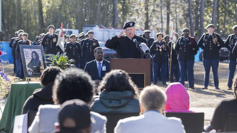 U.S. Lt Col (Ret) Michael Busteed salutes during his remarks during a ceremony to honor the memory of Breonna Moffett, Thursday, Feb. 1, 2024, at Windsor Forest High School in Savannah, Ga. Moffitt joined the Army Reserve in 2019 after graduating from high school. (Stephen B. Morton for the AJC)
