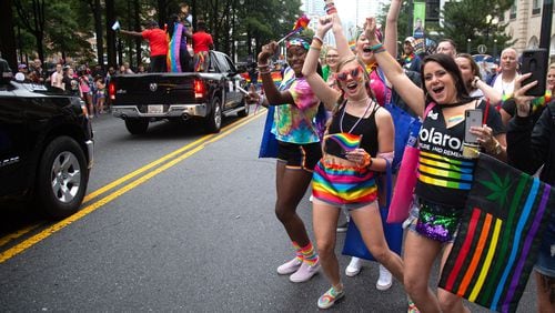 People cheer on the parade during the 49th annual Pride Festival and Parade in Atlanta in 2019.  STEVE SCHAEFER / SPECIAL TO THE AJC