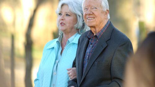 Paula Deen and Jimmy Carter, seen here in Plains in 2006, are teaming up for a unique fundraiser for the former president’s hometown in a few weeks. AJC FILE PHOTO
