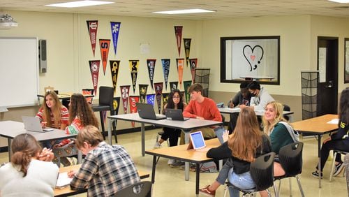 Student tutors work with peers in the tutoring space on the East Etowah High School campus.