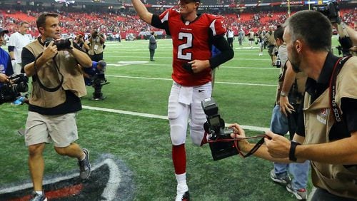 Falcons quarterback Matt Ryan celebrates a 37-34 overtime victory over the Saints in their NFL football game on Sunday, Sept. 7, 2014, in Atlanta.