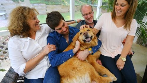 The Schultz family Jeanne, Josh, Jeff and Sierra with their dog Lilly at their Johns Creek home. When Josh went into treatment for opiate addiction the family got a puppy, Lilly, as part of a distraction and a symbol of co-dependency. (Curtis Compton/ccompton@ajc.com)