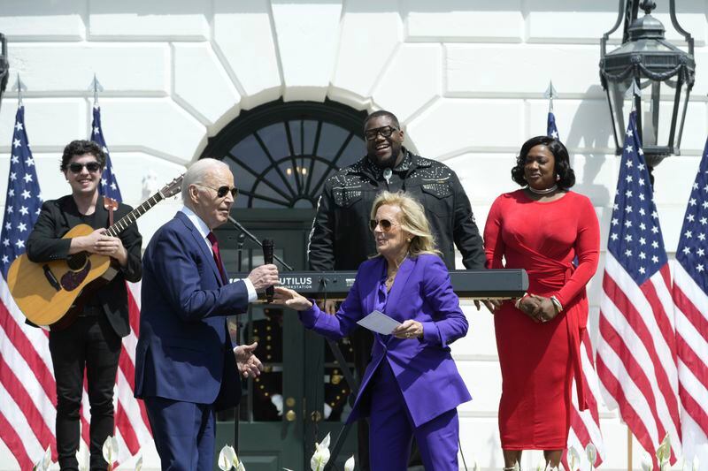 First lady Jill Biden and President Joe Biden greet riders at the Wounded Warrior Project's Soldier Ride on the South Lawn of the White House in Washington, Wednesday, April 24, 2024. (AP Photo/Susan Walsh)
