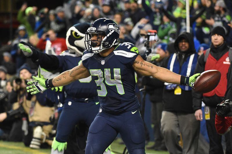  SEATTLE, WA - JANUARY 07: Thomas Rawls #34 of the Seattle Seahawks celebrates scoring a 4-yard touchdown during the fourth quarter against the Detroit Lions in the NFC Wild Card game at CenturyLink Field on January 7, 2017 in Seattle, Washington. (Photo by Steve Dykes/Getty Images)