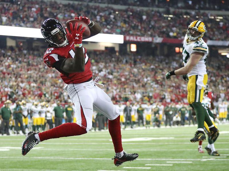 Falcons wide receiver Mohamed Sanu catches a touchdown pass from Matt Ryan past Packers defender Jake Ryan for a 33-32 victory in an NFL football game on Sunday, Oct. 30, 2016, in Atlanta. Curtis Compton /ccompton@ajc.com