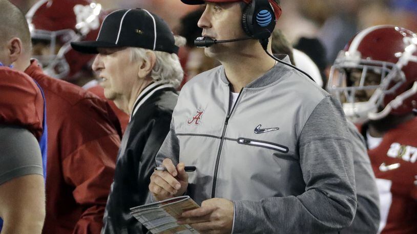 FILE - In this Jan. 9, 2017 file photo, Alabama offensive coordinator Steve Sarkisian stands on the sidelines during the second half of the NCAA college football playoff championship game against Clemson in Tampa, Fla. The Atlanta Falcons have hired Sarkisian as their new offensive coordinator. The move was announced Tuesday, Feb. 7 less than 24 hours after Kyle Shanahan left to become head coach of SF 49ers. (AP Photo/David J. Phillip, File)