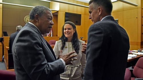 Robb Pitts (left), Chairman of Fulton County Board of Commissioners, celebrates with Meria Carstarphen, superintendent of Atlanta Public Schools, and Jeff Rose (right), superintendent of Fulton County Schools after Judge Alan Harvey ruled to allow Fulton County to collect tax money on Tuesday, August 14, 2018. The county will go back before the judge Tuesday to defend having frozen property values in 2017. HYOSUB SHIN / HSHIN@AJC.COM AJC FILE PHOTO