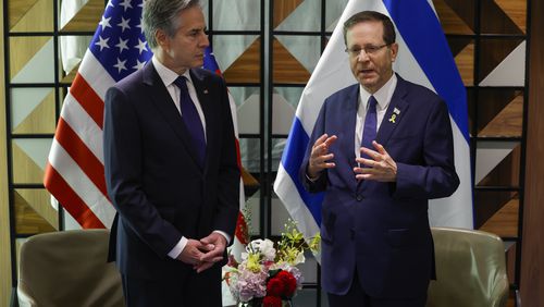 U.S. Secretary of State Antony Blinken, left, and Israeli President Isaac Herzog talk during their meeting in Tel Aviv, Israel, Wednesday, May 1, 2024. (Evelyn Hockstein/Pool Photo via AP)