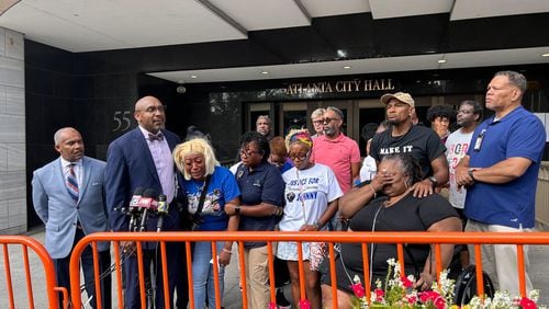 Attorney Mawuli Davis speaks outside Atlanta City Hall on Friday after the family of Johnny Hollman viewed body camera footage leading up to the 62-year-old's death Aug. 10.