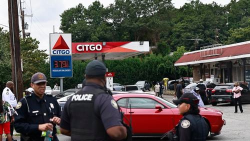 Atlanta Police Department officers stand near the Citgo gas station on Martin Luther King Jr. Drive during a rally against violent crime on Wednesday, August 17, 2022. (Natrice Miller/natrice.miller@ajc.com)