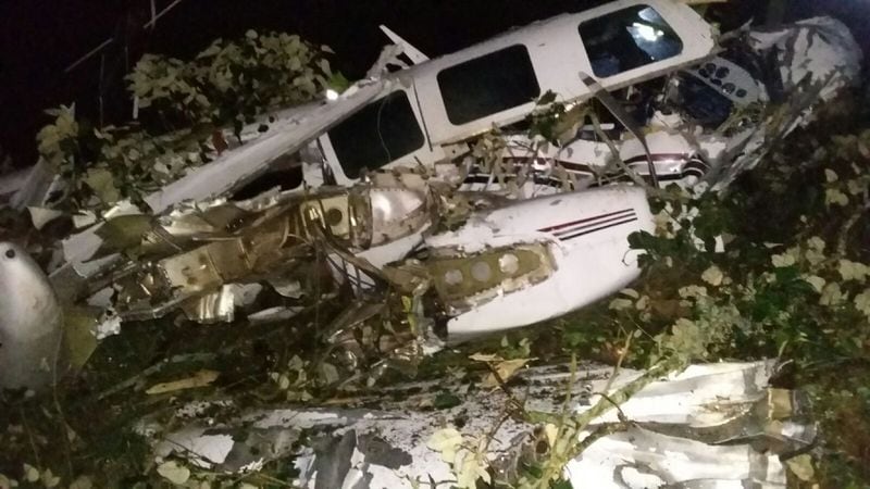 This photo released by the San Pedro de los Milagros Fire Department shows the wreckage of a small plane assigned to the crew of a film starring Tom Cruise, that crashed, in a rural place of San Pedro de los Milagros, Colombia, Friday, Sept. 11, 2015. The country's civilian aviation authority said the twin-engine Aerostar crashed Friday after taking off from a small colonial town near Medellin, killing two people, including a Los Angeles-based film pilot, and seriously injuring a third. (San Pedro de los Milagros Fire Department via AP)