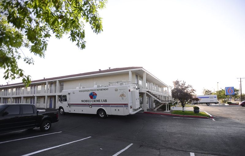 An Albuquerque Police Department mobile crime lab is seen July 1, 2015, after a shooting at the hotel left a man dead and another injured during what police say was an altercation between the two the night before at a Motel 6. 
