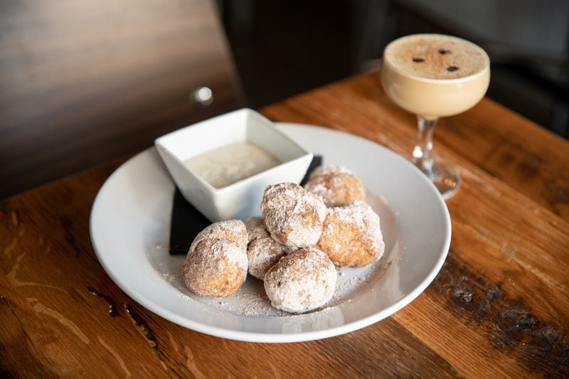 Emmy Squared's Zeppole, fried pizza dough dusted with cinnamon sugar, served with a side of cream cheese mousse. Mia Yakel for The AJC