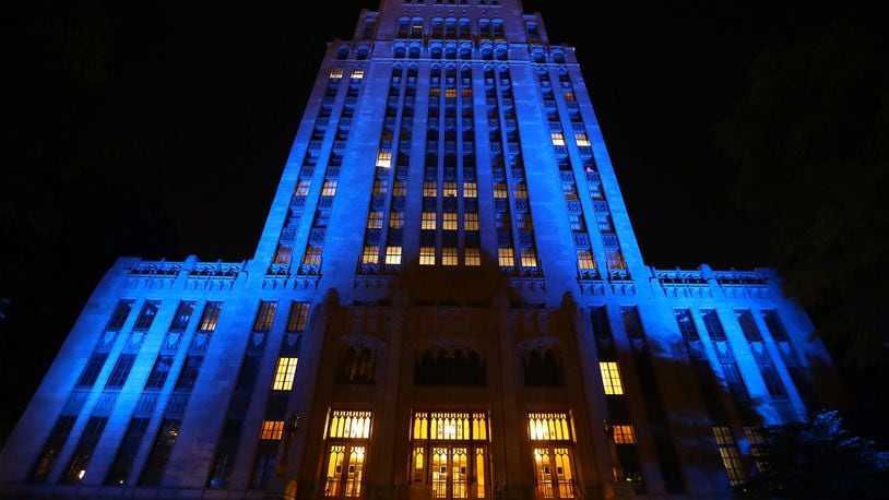 Atlanta City Hall is bathed in blue as part of an initiative to salute essential workers on the frontlines of the coronavirus pandemic on Thursday, April 9, 2020, in Atlanta. Curtis Compton ccompton@ajc.com