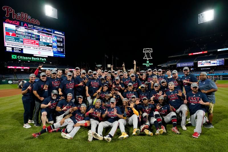 The Atlanta Braves pose for a team photo after clinching their sixth consecutive NL East title by defeating the Philadelphia Phillies in a baseball game, Wednesday, Sept. 13, 2023, in Philadelphia. (AP Photo/Matt Slocum)