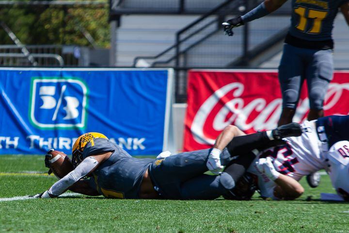Kyle Glover, senior running back for Kennesaw State, dives into the end zone. CHRISTINA MATACOTTA FOR THE ATLANTA JOURNAL-CONSTITUTION.