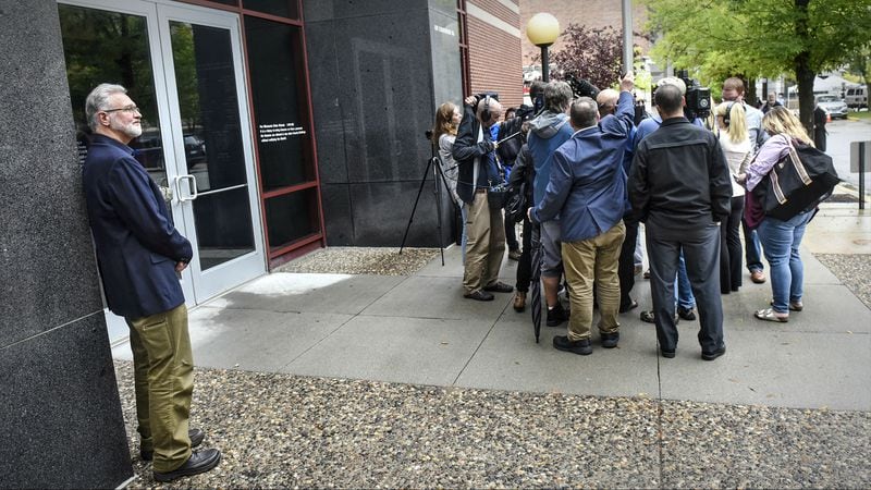 Jerry Wetterling stands alone as reporters circle around former FBI agent Al Garber following a news conference Thursday, Sept. 20, 2018, on the release of investigative files in the abduction and murder of his son, Jacob Wetterling. Jacob Wetterling, 11, of St. Joseph, Minnesota, vanished the evening of Oct. 22, 1989, as he rode home on his bike with his younger brother, Trevor, and his best friend. His disappearance remained unsolved until the fall of 2016, when 53-year-old Danny James Heinrich confessed to killing the missing boy and led police to Jacob’s remains, which were buried on a farm about 30 miles from the site of his abduction.