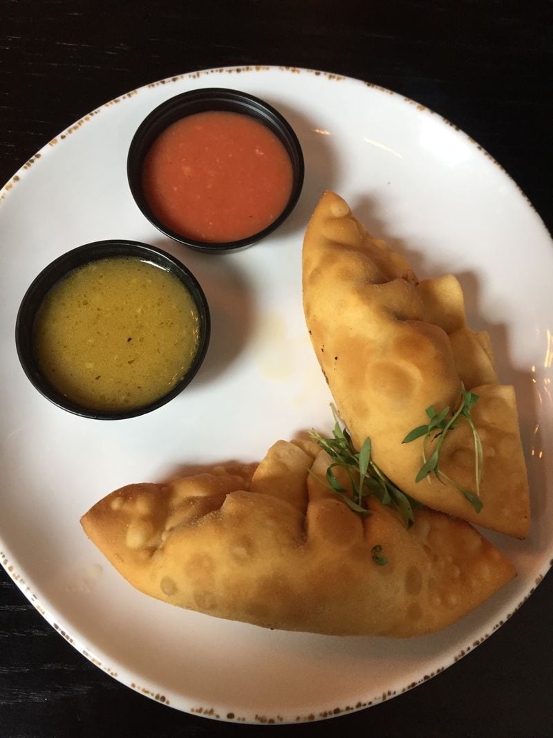  Beni’s Cubano serves up extra-tasty chicken and cheese empanadas that you can enjoy on their own or dipped in a sauce (Beni’s Sauce and Mojo shown here). Credit: Jessie Dowd