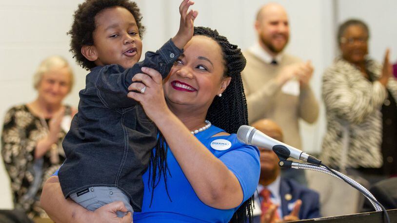 Georgia Sen. Nikema Williams, D-Atlanta, holds her son Carter Small after Williams made her bid to becom the next chairwoman of the Democratic Party of Georgia Chair. January 26, 2019. STEVE SCHAEFER / SPECIAL TO THE AJC