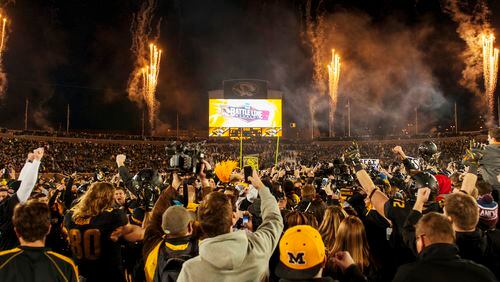 Missouri fans rush the field and celebrate after the team's 21-14 victory over Arkansas in an NCAA college football game Friday, Nov. 28, 2014, in Columbia, Mo. Missouri won 21-14. (AP Photo/L.G. Patterson) Missouri players and fans celebrate a win and the SEC East title. (AP photo)